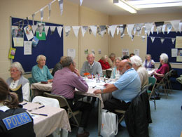 luncheon group around specially designed tablecloths